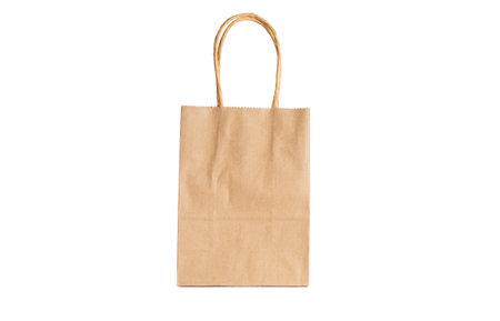 Paper bag with paper handles front side on a white background.の写真素材
