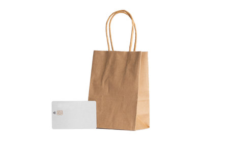 Credit card and paper bag on a white background. mockup.の写真素材
