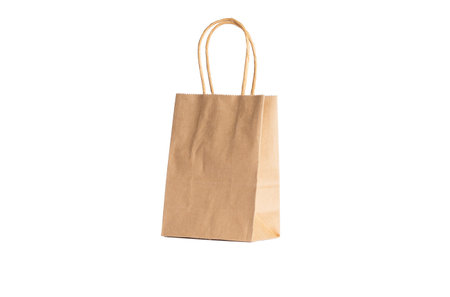 Paper bag with pens isolated on white background.の写真素材