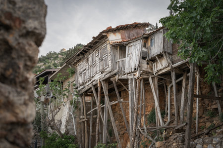 Dilapidated houses on one of the old streets of Alanya. wooden building.の写真素材
