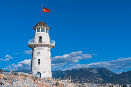 Alanya, Turkey - December 2021: Lighthouse in the port against the blue sky.の写真素材