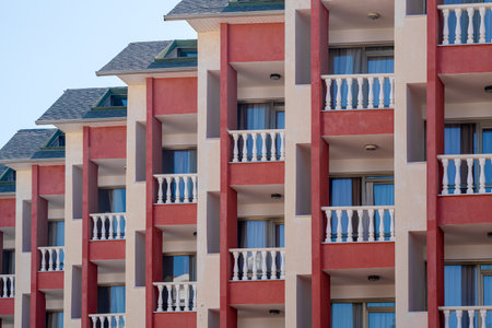 city geometry. A row of small identical balconies with white railings.の写真素材