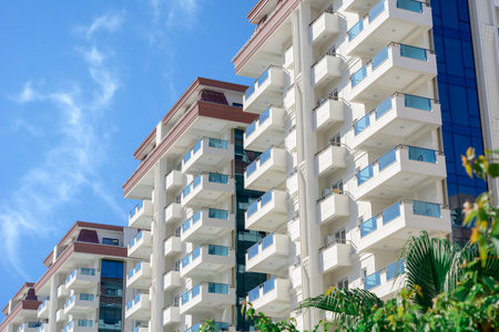 A beautiful modern residential complex consisting of several high-rise apartment buildings. Sunny day.の写真素材