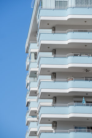 A small part of a large high-rise residential apartment building.の写真素材