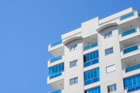 Part of a high-rise residential building. clear day.