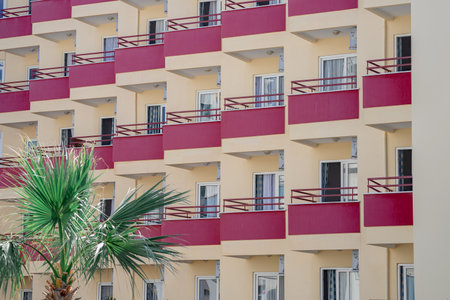 A large number of identical balconies. Fragment of a high-rise building.の写真素材