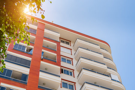 Detail of the exterior of an apartment building. Sunny day.の写真素材