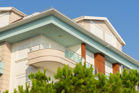 Detail of a modern apartment building. residential properties. blue sky.の写真素材