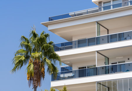 New apartment building with large balconies with glass railings. Modern architecture near the sea coast.の写真素材