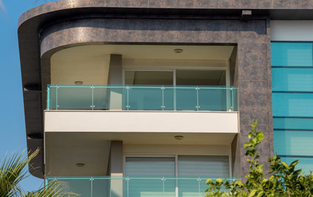 New apartment building with large balconies with glass railings. Modern architecture near the sea coast.の写真素材
