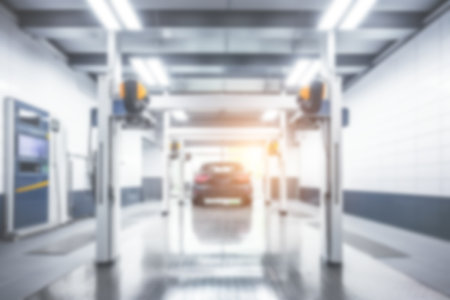 Blurred background of modern car wash bay.の写真素材