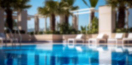 Beautiful blurred background of an outdoor swimming pool near the hotel.の写真素材