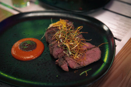 Grilled Wagyu Rump Cap with Kabayaki Sauce over Charcoal, Served in a Restaurantの写真素材