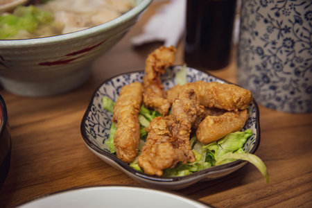 Crispy and Delicious Chinese Traditional Fried Pork Snack Served in a Restaurantの写真素材
