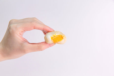 Taiwanese Japanese Golden Salted Egg Yolk Rice Ball on a White Backgroundの写真素材