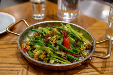 Stir-Fried Green Beans with Spicy Sichuan Sauce, Perfect Harmony of Heat and Crunchの写真素材