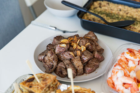Grilled Beef Cubes Seasoned with Garlic on a Ceramic Plate, Ready to Serveの写真素材