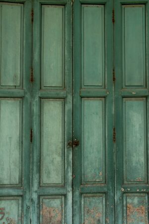 A door green at yaowarat in Bangkokの写真素材