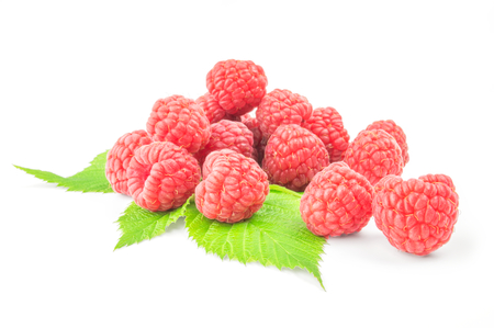 Sweet raspberry with leaves close up on white.