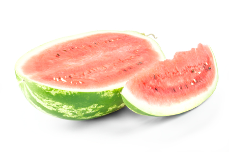Closeup of watermelon (half and slice) on white background.の写真素材