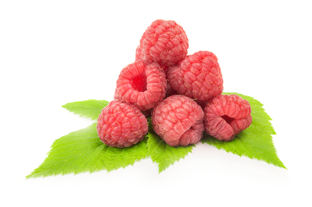 Ripe raspberry with green leaf on white background.の写真素材