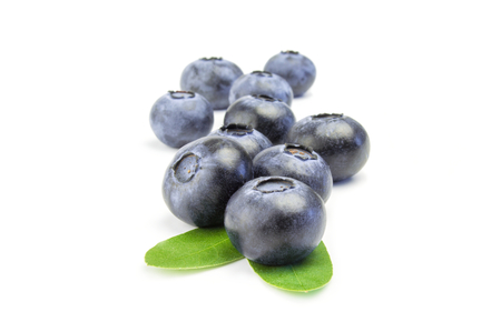 some fresh blueberries one after the other isolated on white.の写真素材