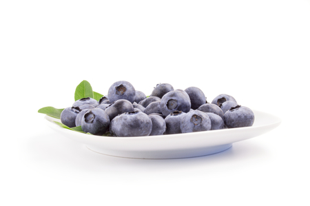blueberry in a bowl isolated on white.の写真素材