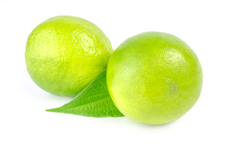 Two lime with leaf  isolated on white background cutoutの写真素材