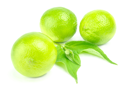 Three ripe limes isolated on white background cutoutの写真素材