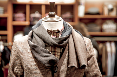 Mannequin in a jacket and scarf in shop.の写真素材