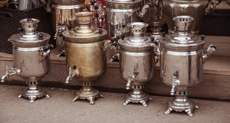 Old samovars in row at a flea market close up.の写真素材
