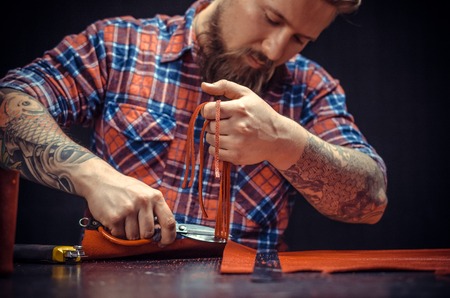 Professional Tanner working with leatherworkの写真素材