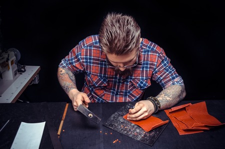 Shoemaker piercing leather product for a shoeの写真素材