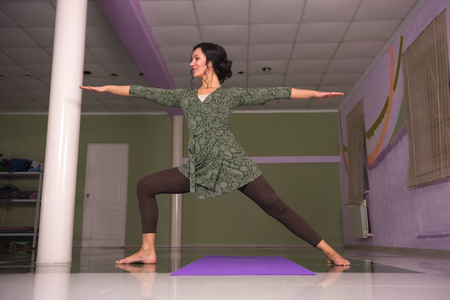 Yoga female working out in yoga in a studioの写真素材