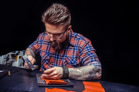 Leather Tanner working with leatherの写真素材