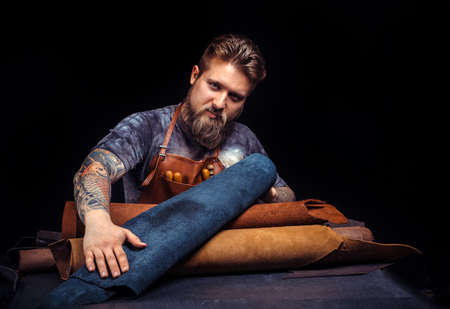 Worker of leather creating a new leather product