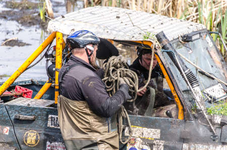 SALOVKA, RUSSIA - MAY 5, 2017: Offroad 4 X 4 car driving through mud and water on annual offroad 4 X 4 car raceのeditorial素材