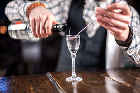 Barman formulates a cocktail in the barの写真素材