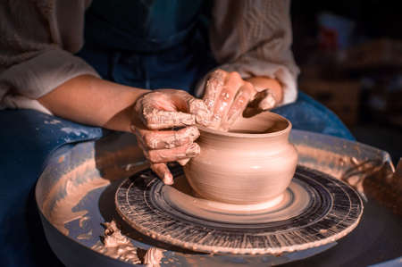 The hands of the master who makes the jug. Close-up.の写真素材