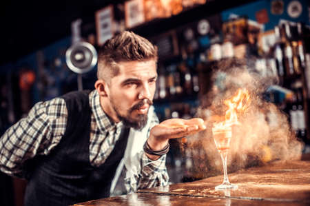 Barman concocts a cocktail on the beerhouseの写真素材