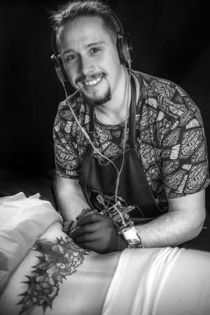 Tattooer makes tattoo art tattoo studio