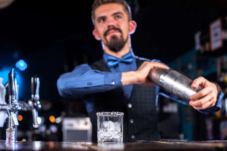Barman formulates a cocktail at the beerhouseの写真素材