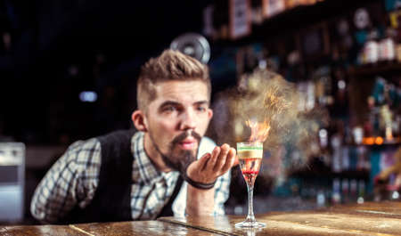 Portrait of bartender creates a cocktail in the pubの写真素材