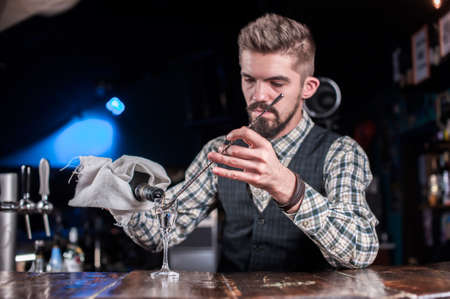 Bartender makes a cocktail in the beerhallの写真素材