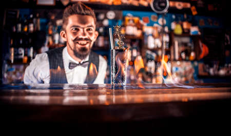 Bartender makes a cocktail at the taproomの写真素材
