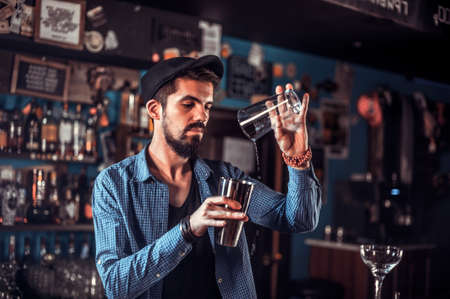 Barman makes a cocktail in the barの写真素材