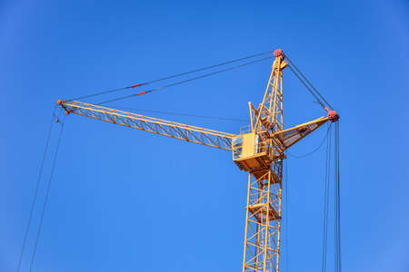The site with cranes against blue skyの写真素材