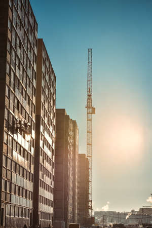 Industrial cranes and new multi-storey buildingの写真素材