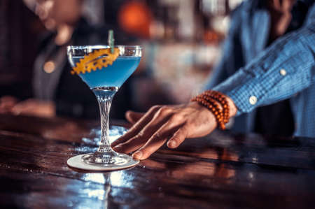 Barman concocts a cocktail in the brasserieの写真素材
