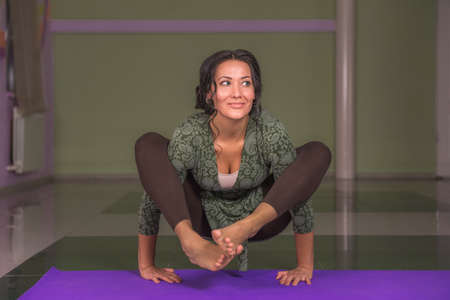 Yoga trainer demonstrating yoga positions